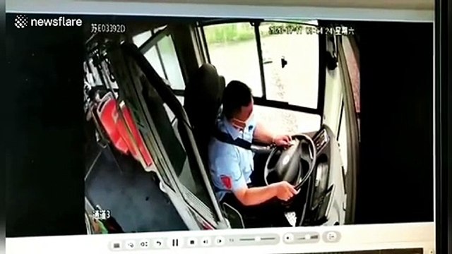 Chinese bus driver gets catapulted out of bus after massive truck collision