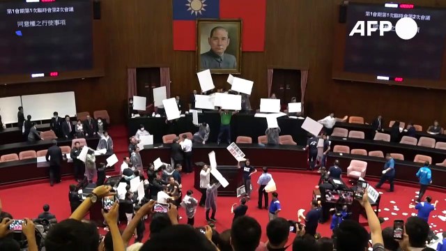 Punches and water balloons thrown in Taiwan parliament melee