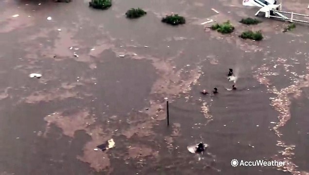 Severe flash flooding traps dozens of people in cars