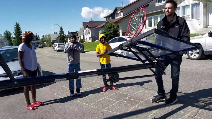 Community Surprises Hardworking Kids With Basketball Hoop