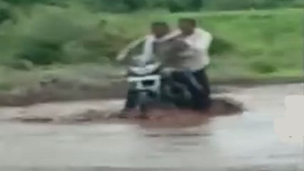 Video: Bike rider drowns in flood water