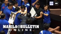 Punches and water balloons thrown in Taiwan parliament melee