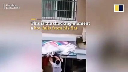 Toddler emerges unscathed from dramatic fifth-storey fall in China