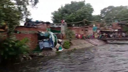 Further footage: Two-story building comes crashing down after heavy rain lashes Indian capital