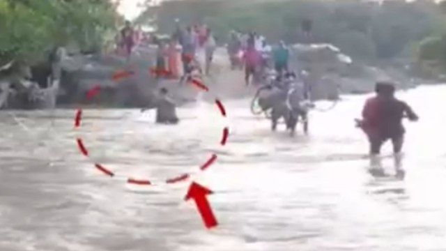 Watch: How man rescued from being washed away by flood water