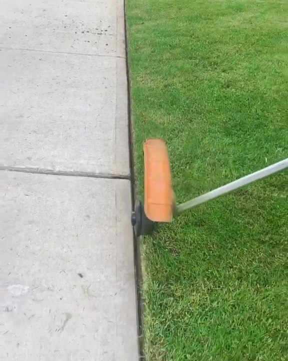 Man Edges Sidewalk Grass Neatly Using String Trimmer video Dailymotion