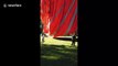 Man clings onto hot air balloon rope in terrifying Lyon street act