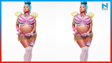 Nicki Minaj announces pregnancy to the world in a bikini, cradling her baby bump