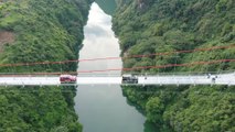 New glass bridge thrills visitors with walk over 526-metre (1,725ft) wide span in southern China
