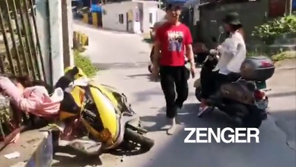 Woman traps head in metal fence after falling off scooter