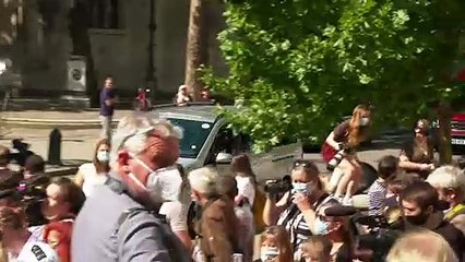 Depp presented with flowers on arrival at court