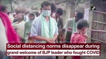 Social distancing norms violated during grand welcome of BJP leader who fought Covid-19