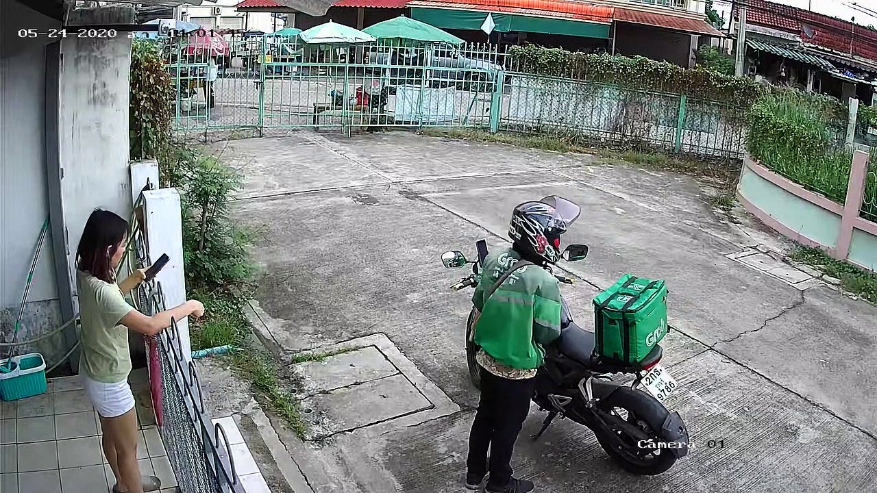 Food Delivery Fail! Woman's Headphones Snag On Gate