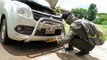 Large snake takes refuge in car's engine and refuses to be rescued in India