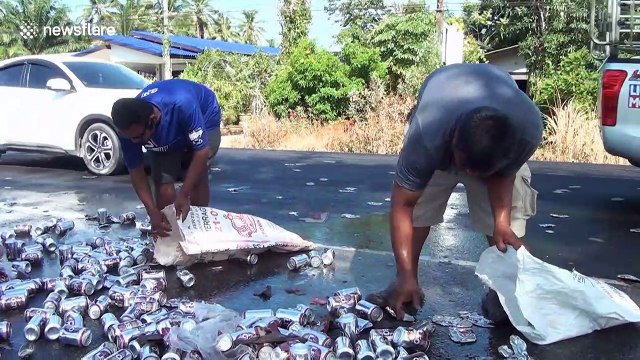 Truck spills hundreds of cans of beer onto road in southern Thailand
