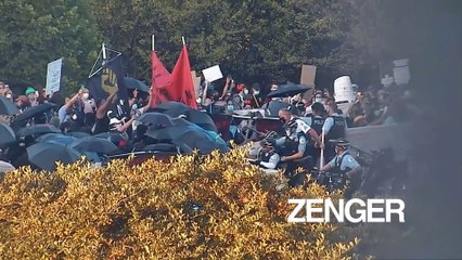 Protesters throw projectiles at Chicago cops protecting a Christopher Columbus monument