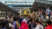 Stranded Mumbai commuters block suburban train service