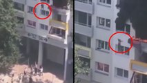 İki çocuk, yanan binanın camından atlayarak kurtuldu