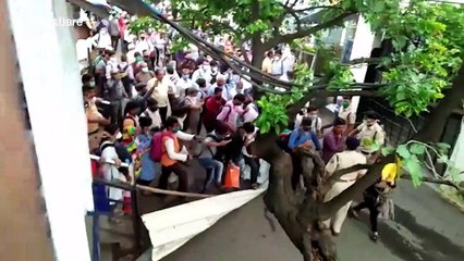 Commuters stage protest demanding to board local trains amid COVID-19 lockdown in western India