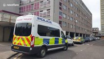 Police search scene of triple shooting in London's Broadwater Farm housing estate