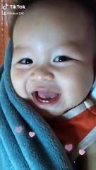 the boy laughs very cute and mischievous
