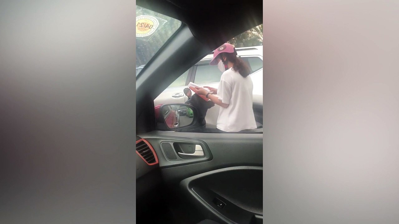 Motorcycle rider does some last-minute revision