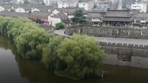 Ancient Chinese city seals gate amid worst flooding in decades