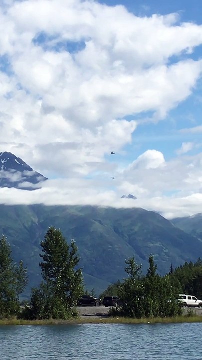 Helicopter Helps Stricken Plane Fly