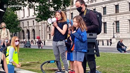 Parents create a human wind-farm outside Downing Street to tackle climate change