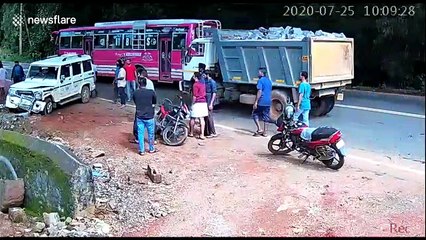 Man saved at last second by SUV as digger speeds towards him in India