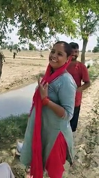 poor farmer singing during cultivation