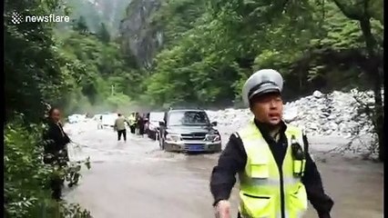 Ferocious mountain flood traps 153 people and 45 vehicles in southern China