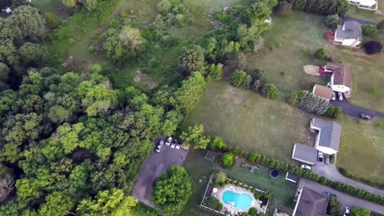 DJI Mavic air 2 flies 400 ft. Above New York suburbs.