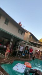 Girl Jumping into Pool From Roof Falls Short