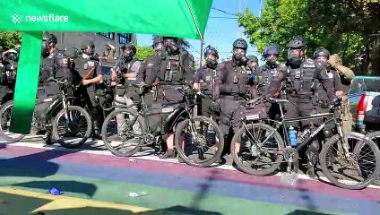 Seattle police officer uses bike to hit protester during push back