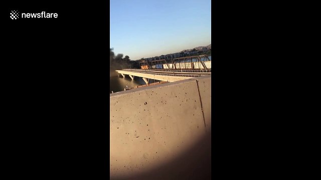 Locals watch smoke billow into sky after train derailment and bridge collapse in Tempe, Arizona