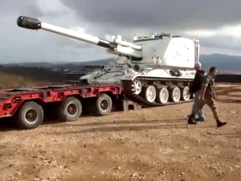 White Tank Falls off Flatbed Trailer