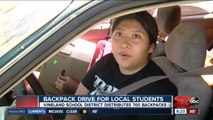 Hundreds of backpacks distributed at drive-up backpack drive