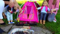 Cute girl playing with Dolls & Grilling MArshmallows smores