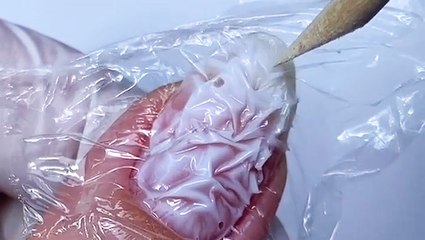 Use saran wrap to make a marbled manicure design