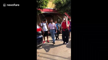Beirut civilians line streets armed with brooms as cleanup operations begin