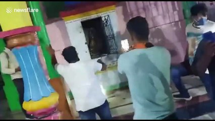 Officials rescue and relocate 10-foot long cobra found in southeast Indian temple