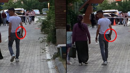 Mesire alanında beline taktığı tabancayı göstere göstere yürüdü