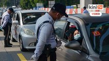 Polis tarik balik saman tak pakai topeng muka dalam kereta