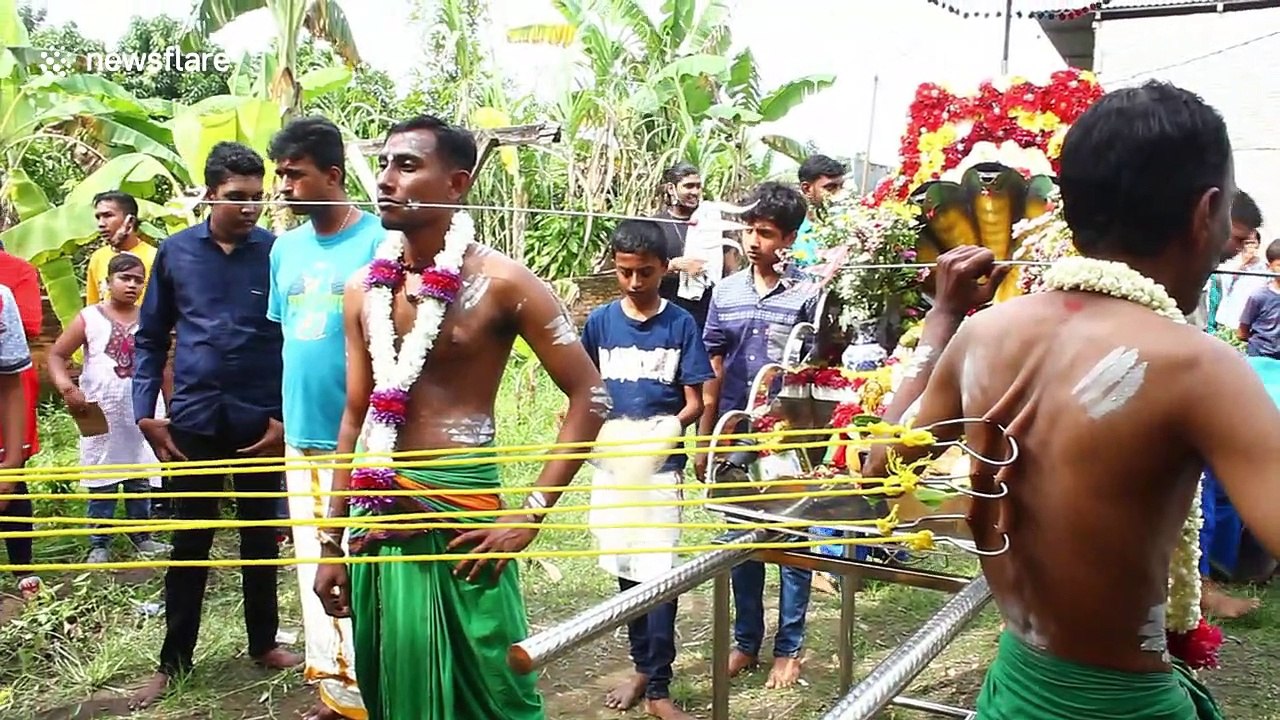 Annual Indonesian festival sees locals pierce their cheeks and backs