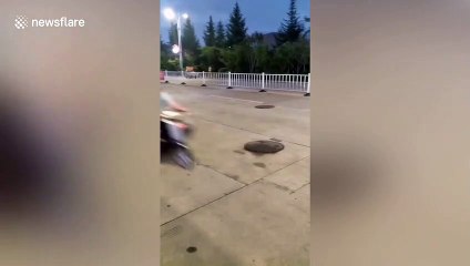 Manhole covers spotted bouncing up and down on Chinese road