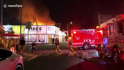 Fire erupts in West Hollywood, California commercial structure