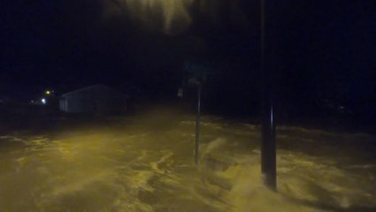 Homes flood as storm surge races through roads
