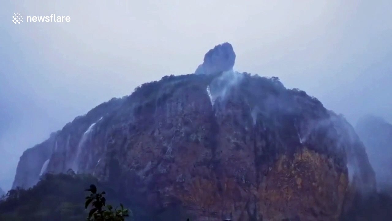 Strong winds brought by typhoon Hagupit blow waterfall up into air