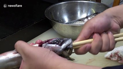 Ancient cooking hack to gut a fish in a few seconds using only chopsticks